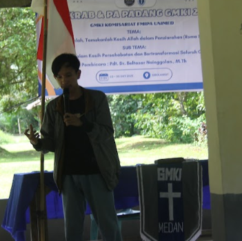 A person speaking into a microphoneAI-generated content may be incorrect.